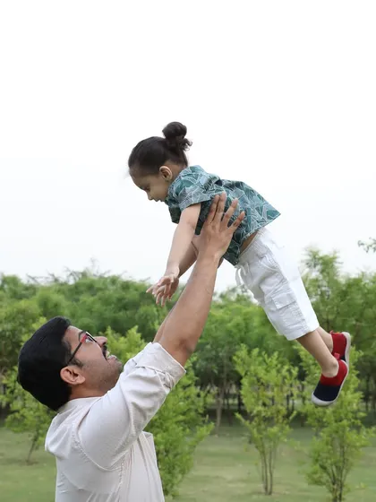 A classic, joyful moment between a father and his child during an outdoor family shoot. My goal is to capture the energy and happiness of your family in a natural, unscripted way.