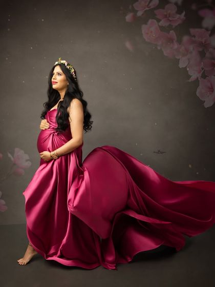 Another stunning flying fabric portrait. The magenta gown seems to dance in the air, creating a magical and ethereal image of the mother-to-be.