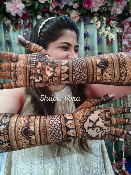 Showing the reverse side of the arms, where the intricate patterns continue to tell a cohesive story.