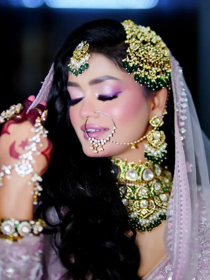 A playful and happy shot. The makeup is designed to be long-lasting and picture-perfect for festival celebrations.
