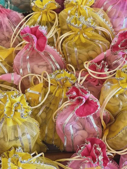 A cascade of colorful potlis, a key element in my traditional Indian gift styling.