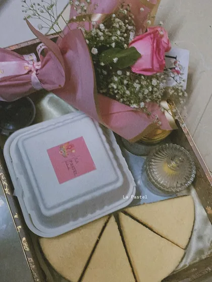 The full pink hamper, packed and ready to go. This shows the final presentation with the bento cake box closed.