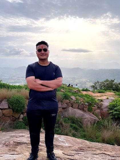 A confident pose from a happy trekker on the Makalidurga trail, enjoying the sense of accomplishment.