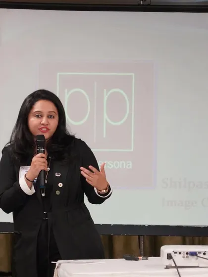 A close-up from a speaking engagement. I believe in using clear, direct communication to break down complex topics like personal branding and image management for my audience.