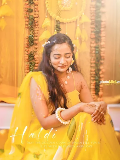 A serene portrait of the bride during her haldi ceremony, capturing a quiet moment of reflection amidst the vibrant celebrations.