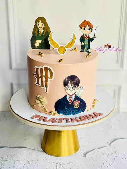 Bringing the magic of the wizarding world to a birthday celebration with this Harry Potter themed cake. It features iconic elements like the golden snitch and beloved characters, perfect for fans of any age.