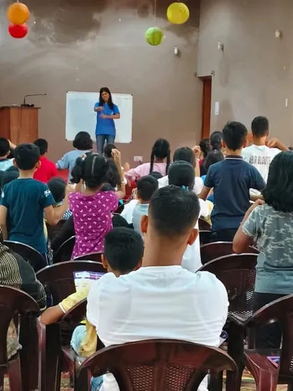 Children on stage during an interactive session in Ranchi. Getting kids to move and participate physically is a key part of our teaching methodology, making learning an active, not passive, experience.