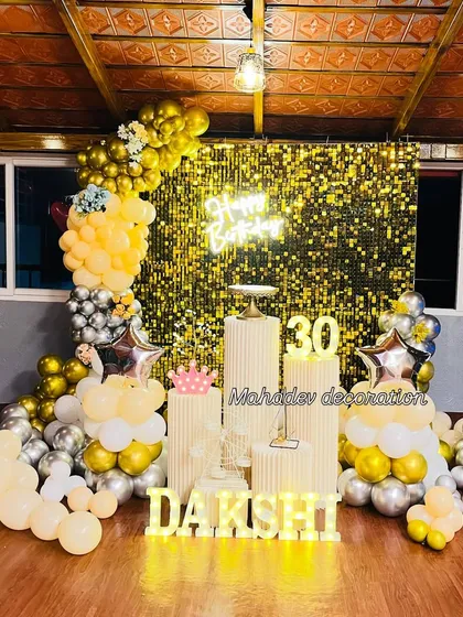 Here is another take on the popular shimmer wall backdrop, perfect for a 30th birthday party. I combined a gold sequin wall with a balloon arch in pastel yellow, white, and chrome silver, along with custom marquee lights for the name and age.