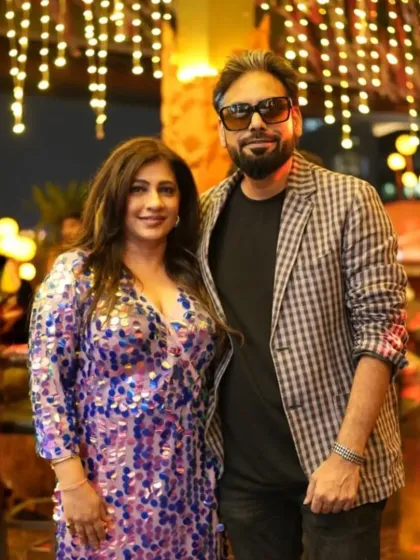 Another moment with a guest at our Christmas social. The elegant decor with hanging lights provides the perfect backdrop for a dressy night out.