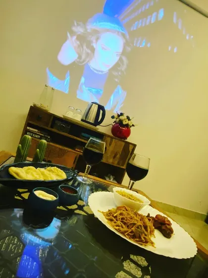 Enjoy a delicious meal with your partner while a movie or show plays in the background. It's the perfect setup for a dinner and movie date.