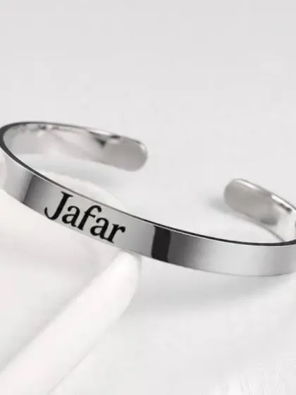 Another example of the personalized metal kada, this one engraved with the name 'Jafar' in a clean, bold font.