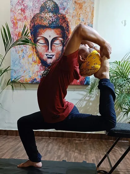 Here is a demonstration of the One-Legged King Pigeon Pose, or Eka Pada Rajakapotasana, using a chair for support. This shows how we use props to make advanced poses more accessible and help you work on flexibility safely.