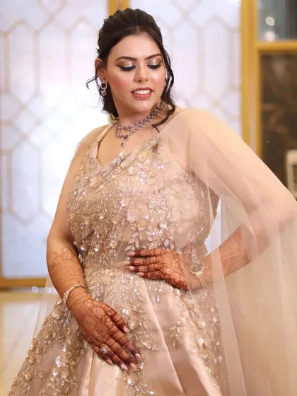 Another elegant pose showcasing the beautiful makeup and gown.