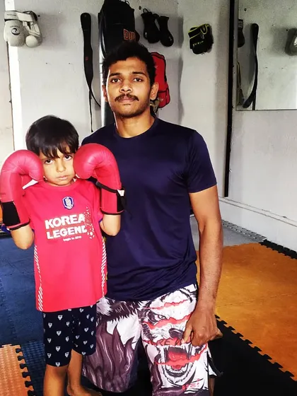 Every champion starts somewhere. This young student is learning the basics of stance and guard. Building a strong foundation is the most important part of the martial arts journey.