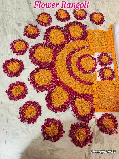 This intricate flower rangoli was the centerpiece of the floor decor. The pattern is designed to hold the small bowls of food offered during the Annaprashan ceremony.