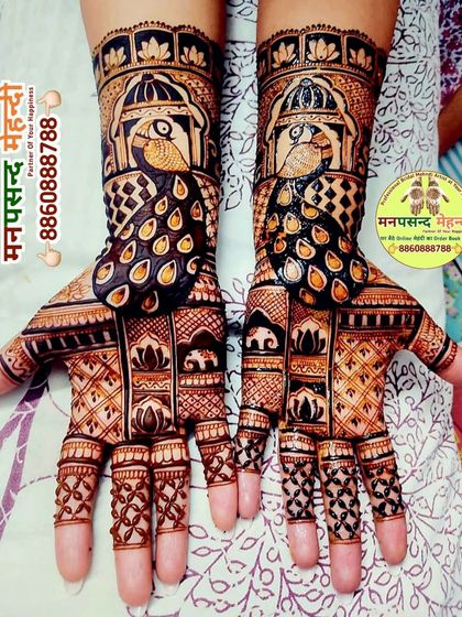 A stunning peacock-centric design, with the birds prominently featured on both palms and forearms. The intricate feather work and surrounding patterns are exceptionally detailed.