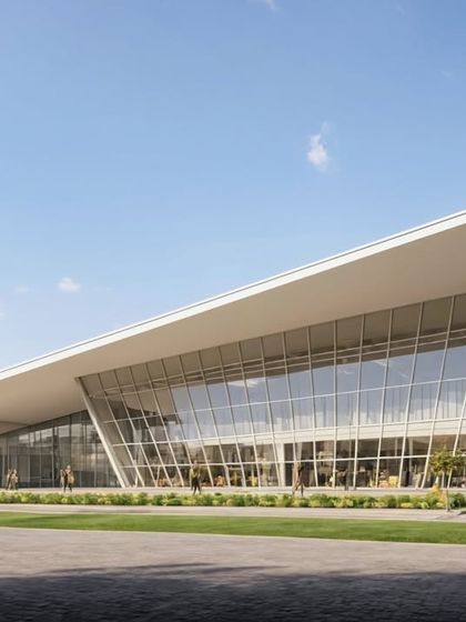 This commercial complex in Goa features a striking glass facade with an angular, sloping roof. The design reflects the vibrant, modern energy of the city and is planned to house retail, dining, and entertainment facilities.