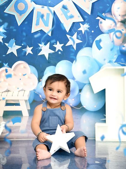 Confetti and smiles! A joyous moment from a starry night themed first birthday, celebrating this huge milestone with a shower of happiness.