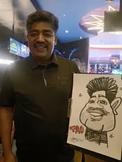 This guest was thrilled with his caricature. I enjoy bringing my art to professional gatherings.