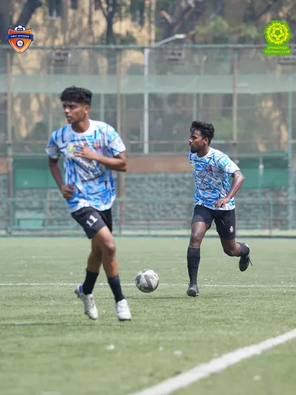Two of our players working in tandem, showcasing the chemistry and understanding that defines our teamwork.