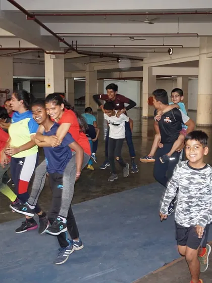 We work hard, and we have fun. Here, our campers enjoy a team-building game during a break from drills. I believe that a positive and joyful environment is essential for learning and building lasting friendships.