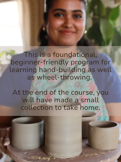 A happy student holds up her first thrown cylinders, showcasing the tangible results of our foundational, beginner friendly program.