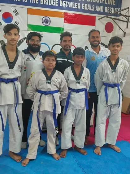 The blue belt students, who have mastered intermediate techniques and are now working on advanced skills.