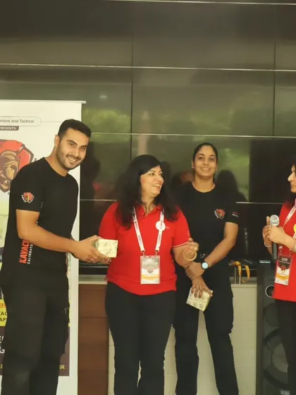 A male Kavach instructor being felicitated on stage by the ANON foundation.