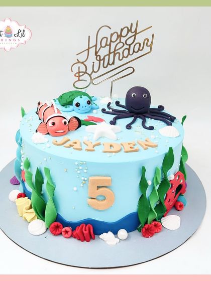 Just keep swimming! This Finding Nemo-themed cake for a 5th birthday is an underwater delight, featuring Nemo, Squirt, and an octopus.