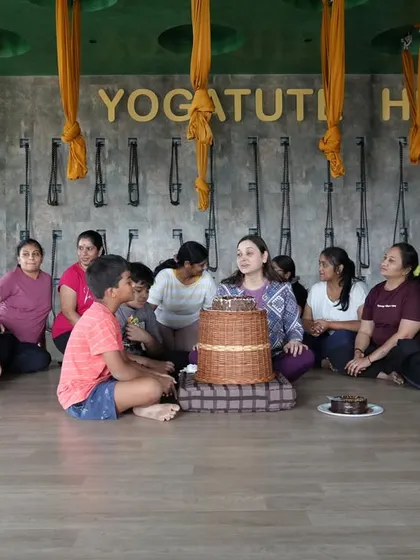 The birthday group gathered around a healthy, satvick cake. It is wonderful to see people choose wellness and togetherness to mark special occasions.