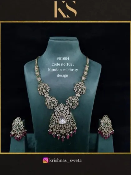 The same Kundan celebrity design, here with ruby and white stone accents. The oxidized finish gives it a unique, antique charm.