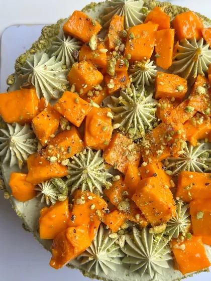 It's almost time to say goodbye to my second favorite fruit! This is a close-up of my Pistachio Mango cake, topped with fresh mango chunks and crushed pistachios.