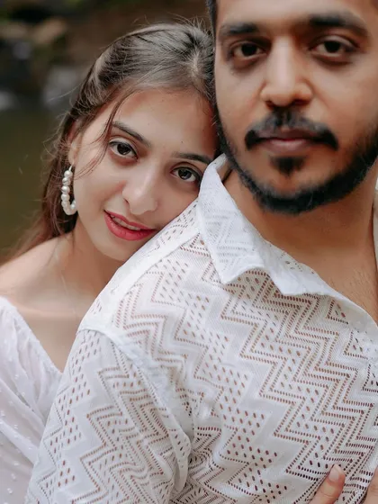 A stunning close-up portrait where she rests her head on his shoulder. This image is all about trust, comfort, and the deep affection between the couple.