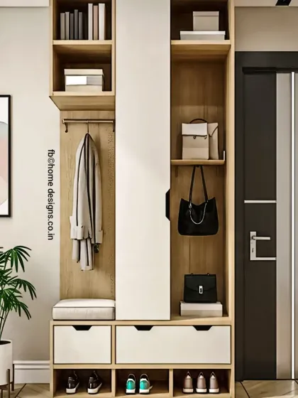 This entryway unit is a complete storage solution, featuring a shoe rack, a bench, coat hooks, and shelving for bags. The light wood and white finish gives it a modern and airy feel.