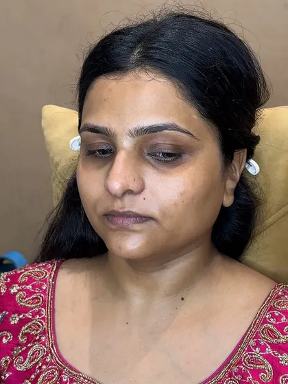 A before shot of a client, showing her natural skin before the makeup application. This is the starting point for all my transformations.