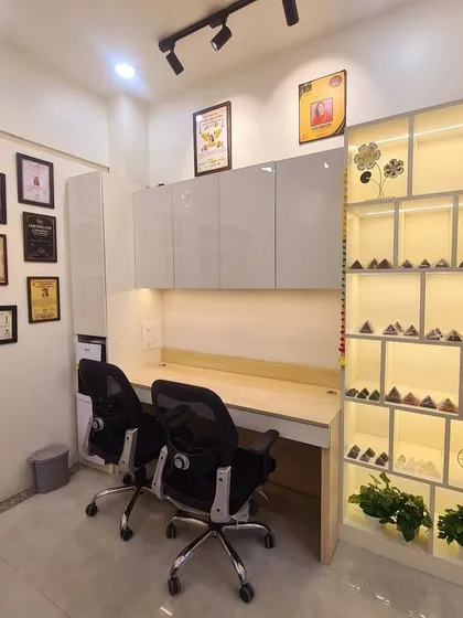 A closer look at the energized workspace. This view shows the framed awards on the wall and the illuminated shelf holding various energized items. Every element is placed thoughtfully to maintain a high-vibrational environment for my work.