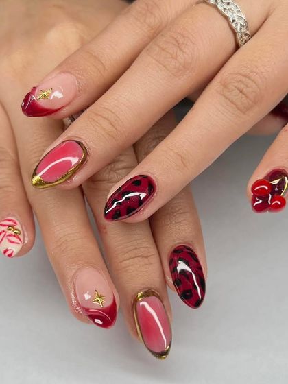 A close-up of this bold and playful set, showing the detail in the leopard print, 3D cherries, and gold chrome.