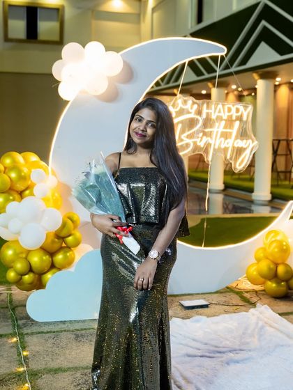 A client posing with our dreamy moon-themed birthday decor. This setup is perfect for anyone who loves a touch of celestial magic.
