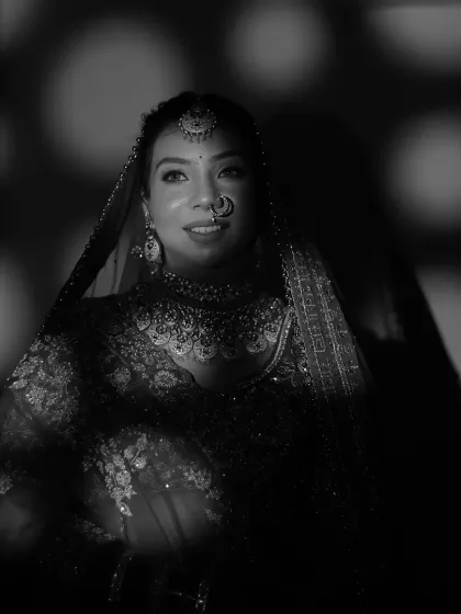 A dramatic black and white bridal portrait using patterned light. This artistic technique creates a unique and moody atmosphere, turning a simple portrait into a captivating piece of art.