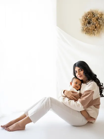 A beautiful mother and child portrait from a minimalist session. This style is all about clean lines, soft light, and the authentic connection between you and your baby.