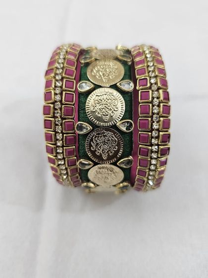 Different angles showcasing the craftsmanship of the green and ruby silk thread bridal bangle set with antique coin details.