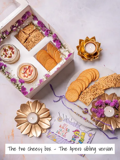 The 'Two Cheesy Box', our Apero sibling version for Rakhi. It comes with two of our signature cheese dips and crackers, because some things are better in pairs.