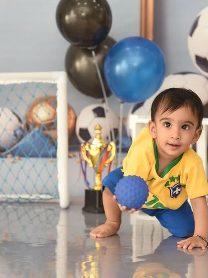 Ready for the world cup! This football-themed shoot is perfect for a little sports fan, complete with a goal, trophy, and lots of soccer balls.