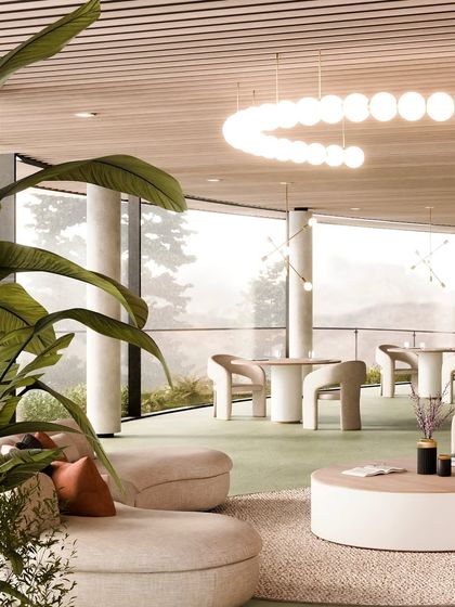 The lounge area of the resort, with its panoramic windows, offers an immersive experience of the surrounding pine forest.