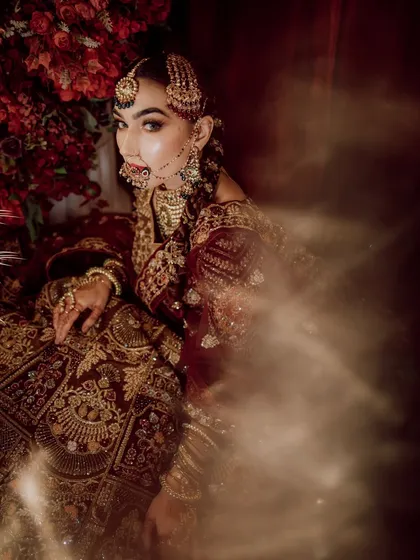 Our "Chand ka Tukda" bridal campaign. This image captures a dreamy, artistic portrait of our model, showcasing a regal and traditional bridal style.