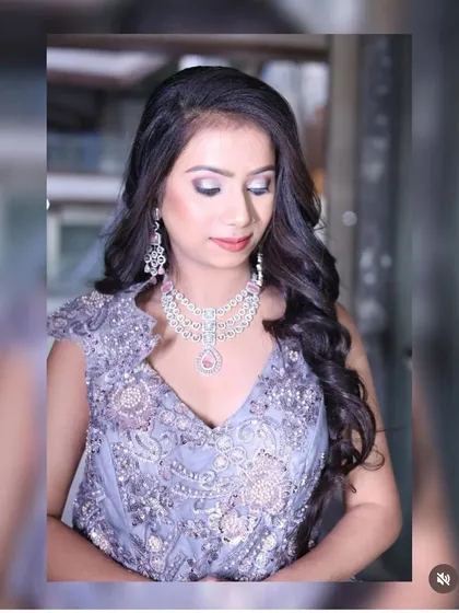 A portrait shot focusing on the makeup and jewellery paired with the lavender-grey gown, showing how to complete the look.