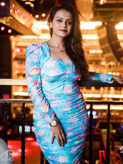 A guest posing on the balcony.