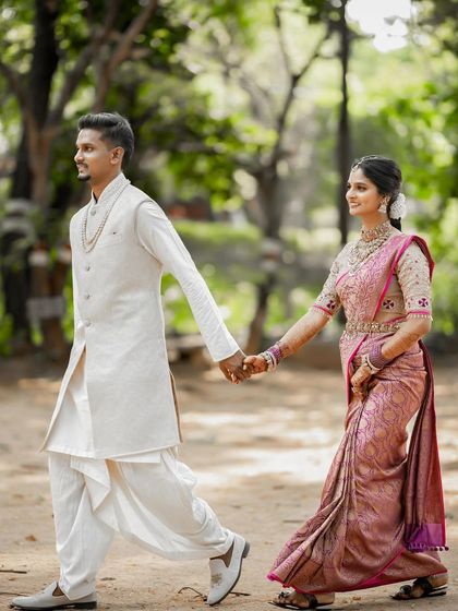 My stunning couple, Bhuvana and her groom, walking hand-in-hand. I love creating looks for both the bride and groom to ensure they complement each other perfectly.