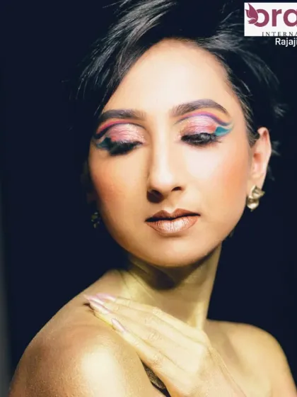 This shot highlights the beautiful blend of colors in the eyeshadow and the radiant gold shimmer on the skin.