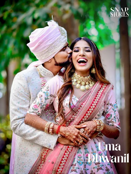 The pure, uninhibited laughter between a couple is what we live to capture. This candid shot showcases the genuine connection and happiness that make wedding photography so special.